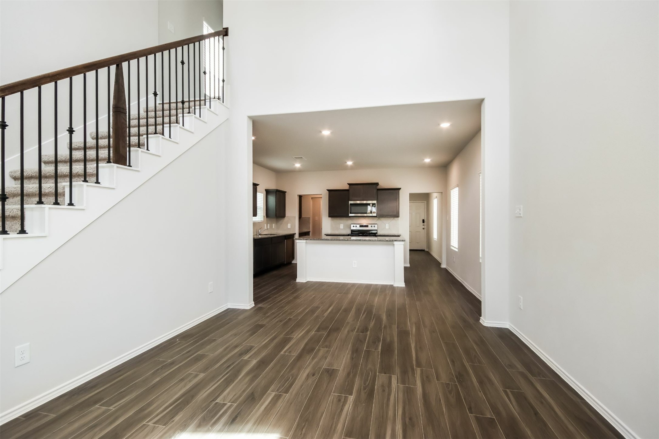 15264 Estrella Road East Houston, TX 77073 - Photo 6 of 14 a view of kitchen with wooden floor