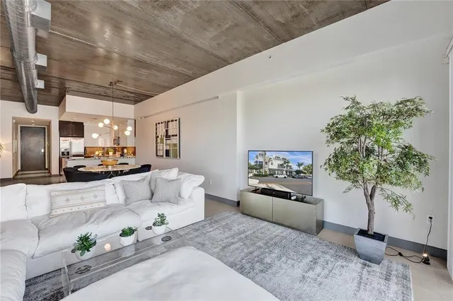 a view of a dining room with furniture and a chandelier