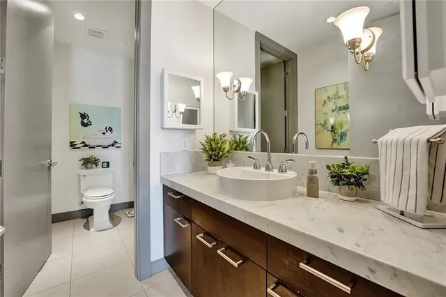 a white toilet sitting next to a bathroom