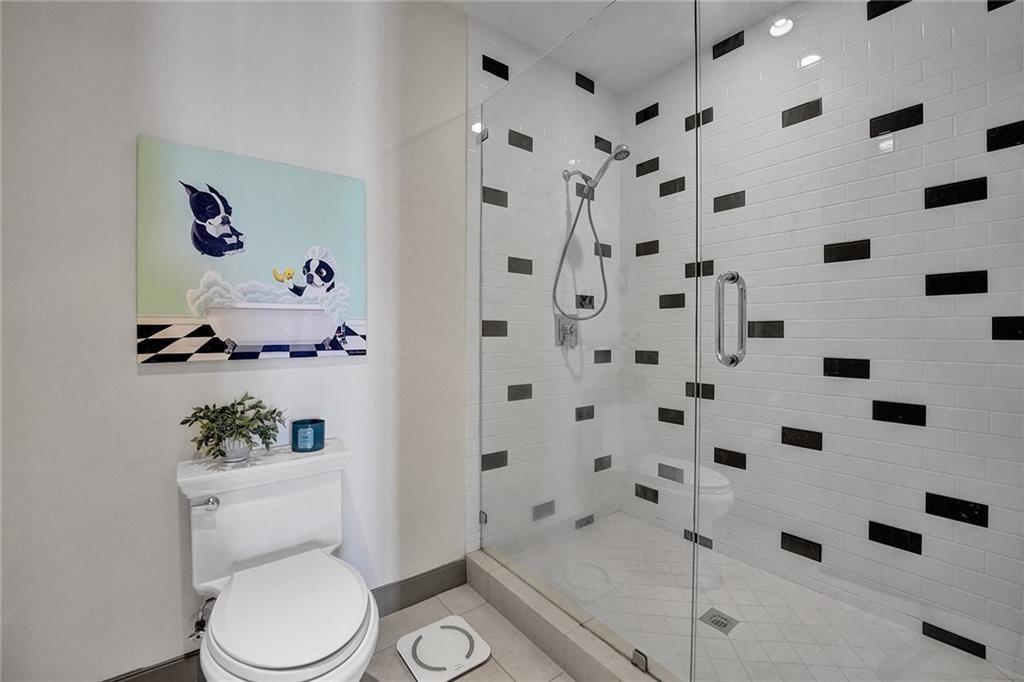 110 Southeast 2nd Street, Unit 402 Delray Beach, FL 33444 - Photo 29 of 49 a white toilet sitting next to a bathroom