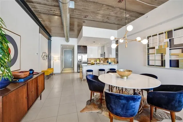 a dining room with furniture and wooden floor