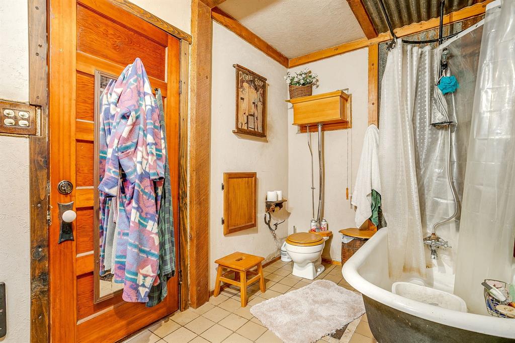 1035 Summit Drive Springtown, TX 76082 - Photo 25 of 38 Bathroom with tile patterned floors and a textured ceiling