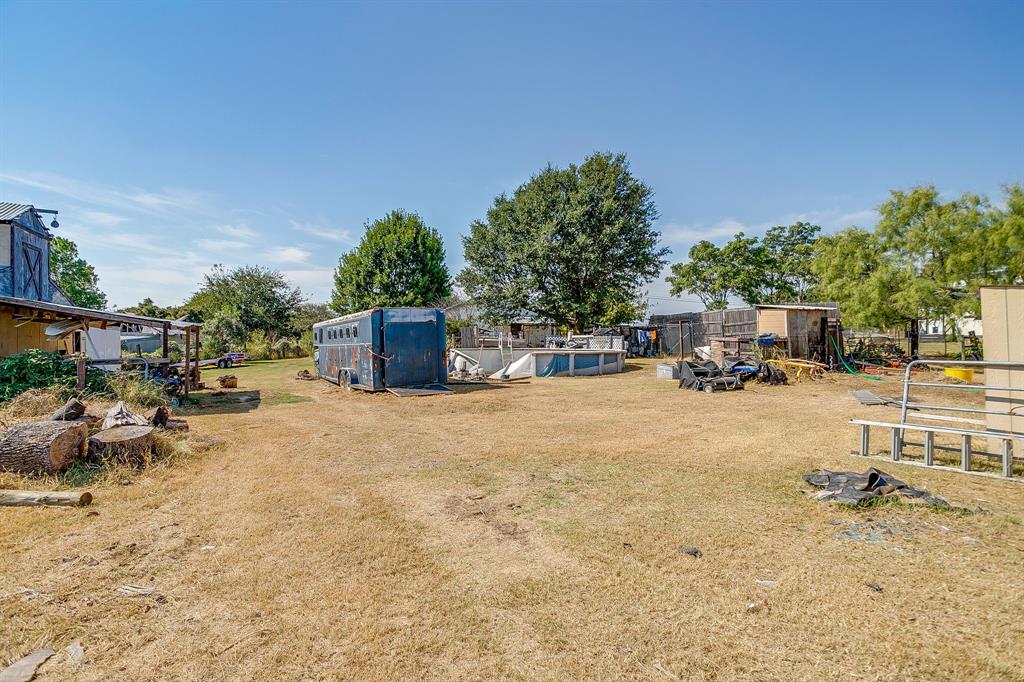 1035 Summit Drive Springtown, TX 76082 - Photo 32 of 38 View of grassy yard featuring an outbuilding
