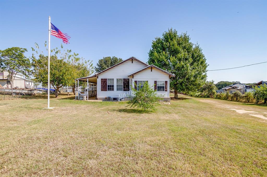 1035 Summit Drive Springtown, TX 76082 - Photo 4 of 38 Back of property featuring a yard