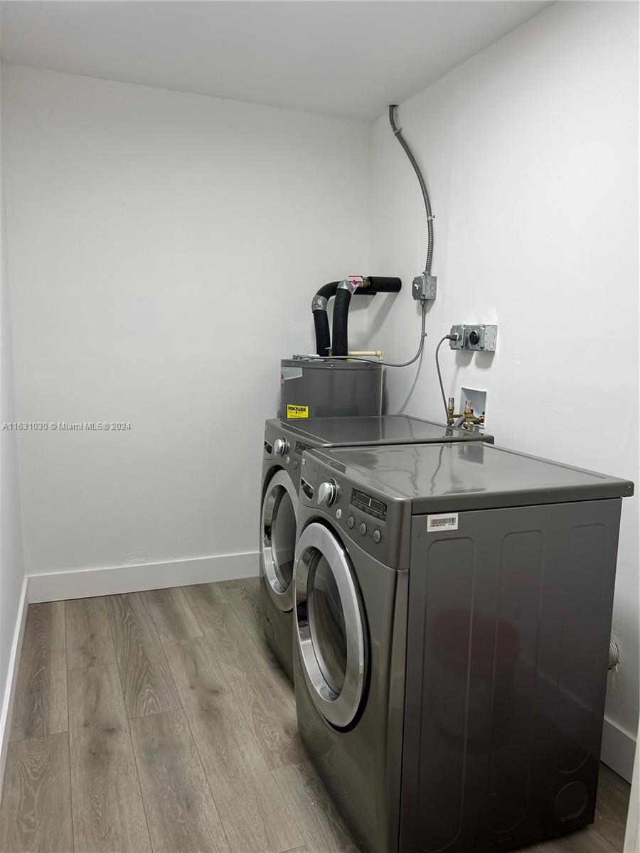 945 Curtiss Drive Opa-Locka, FL 33054 - Photo 18 of 18 a utility room with dryer and washer