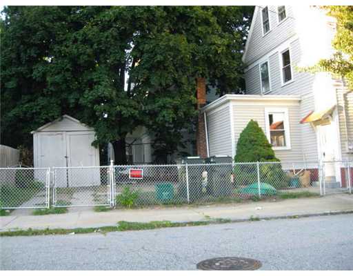 94 Ruggles Street Providence, RI 02908 - Photo 3 of 12 Exterior Back. BACK YARD AND GARAGE