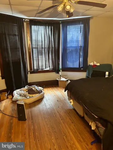 a room with a flat screen tv and gym equipment