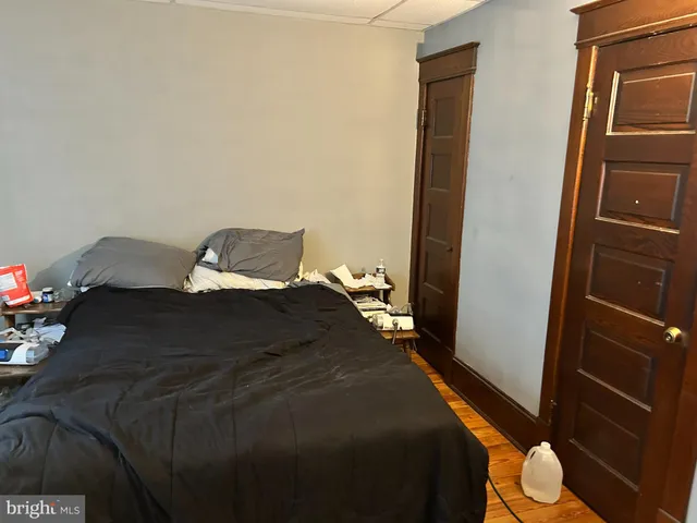 a bedroom with a bed and a closet