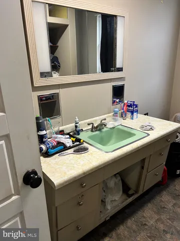 a view of storage and utility room with a sink