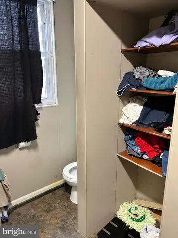 a room with gym equipment and a window