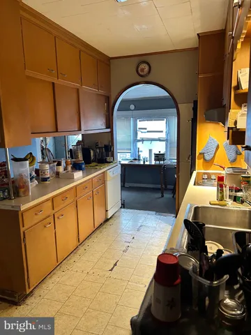 a kitchen with stainless steel appliances granite countertop a sink counter space cabinets and a window