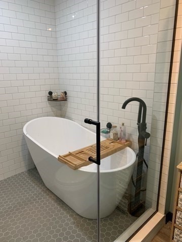 212 Arnold Road Sturbridge, MA 01518 - Photo 8 of 21 a white bath tub sitting in a bathroom