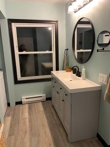 212 Arnold Road Sturbridge, MA 01518 - Photo 10 of 21 a bathroom with a sink and a mirror