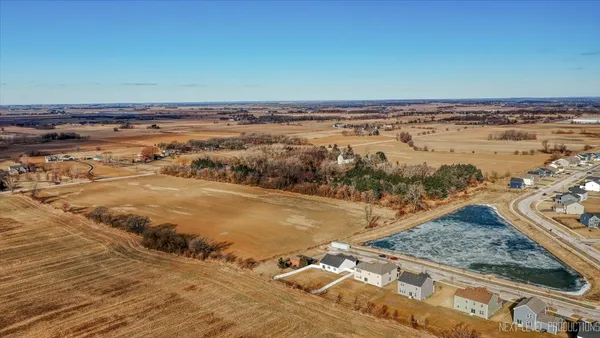 a view of a large body of water with lots of trees in the background