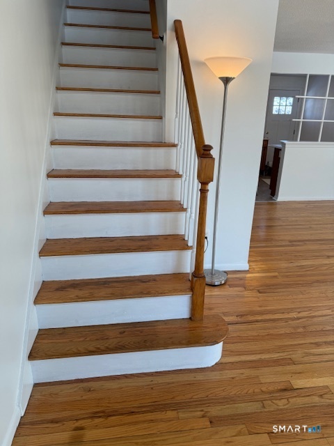 280 East Main Street, Unit E2 Clinton, CT 06413 - Photo 9 of 20 Stairs to second floor with attractive bannister.