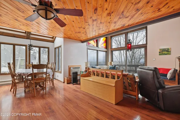 a en suite bathroom with a granite countertop sink and a mirror