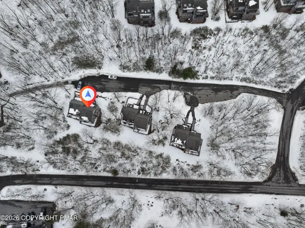 a view of a white building with a tub and couches