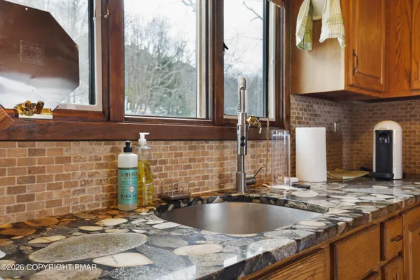 a kitchen with refrigerator and stove