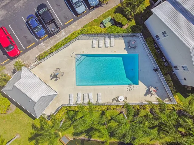 a view of a pool with a yard