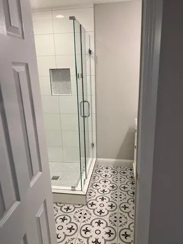 a bathroom with a shower and a toilet