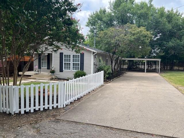 117 Ida Street McKinney, TX 75069 - Photo 16 of 20 a view of a house with wooden fence next to a yard