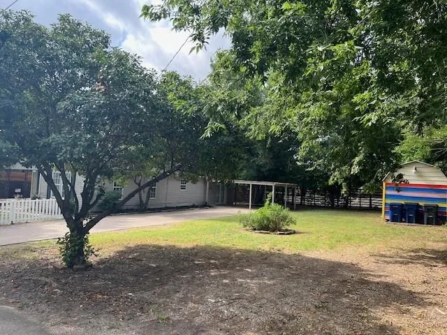 a view of a house with swimming pool and sitting area