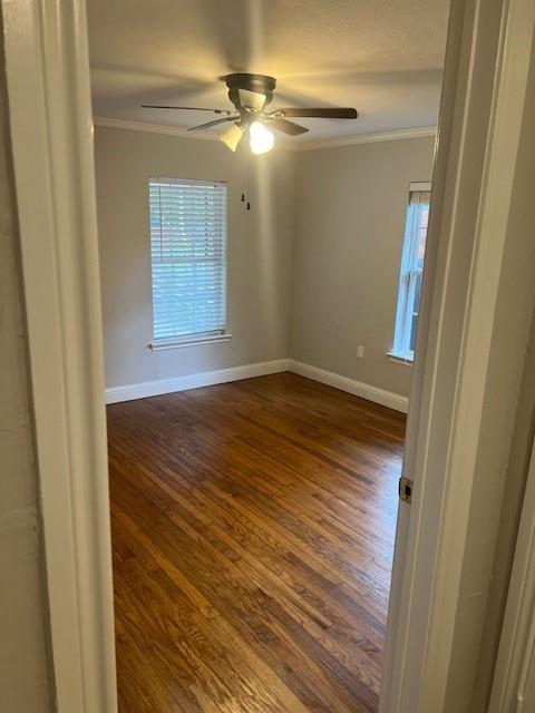 117 Ida Street McKinney, TX 75069 - Photo 4 of 20 a view of empty room with wooden floor and fan