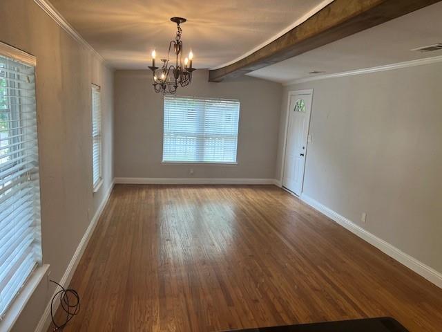 117 Ida Street McKinney, TX 75069 - Photo 7 of 20 a view of a room with wooden floor and chandelier
