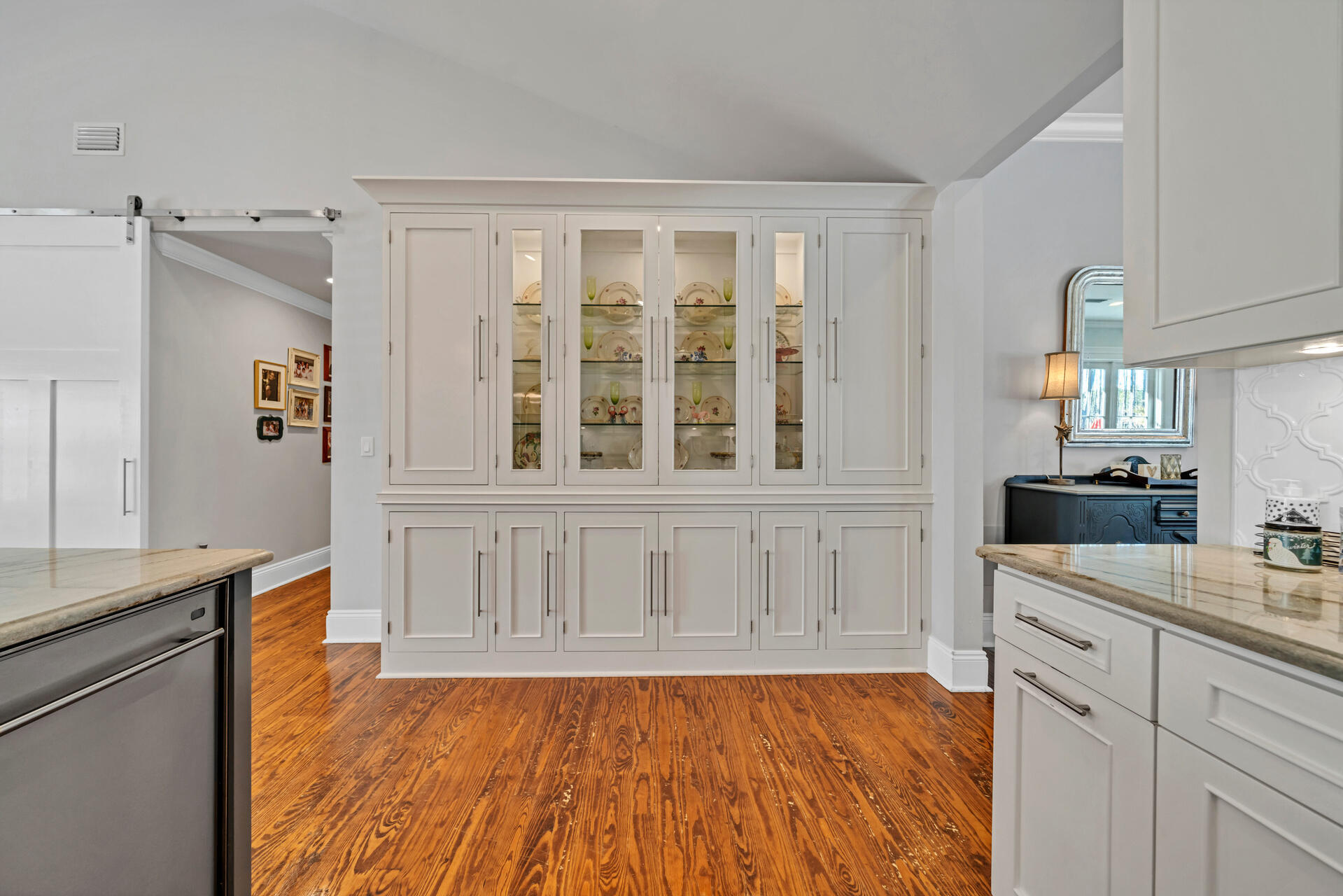90 Delbert Lane Santa Rosa Beach, FL 32459 - Photo 11 of 47 a kitchen with granite countertop white cabinets and wooden floor
