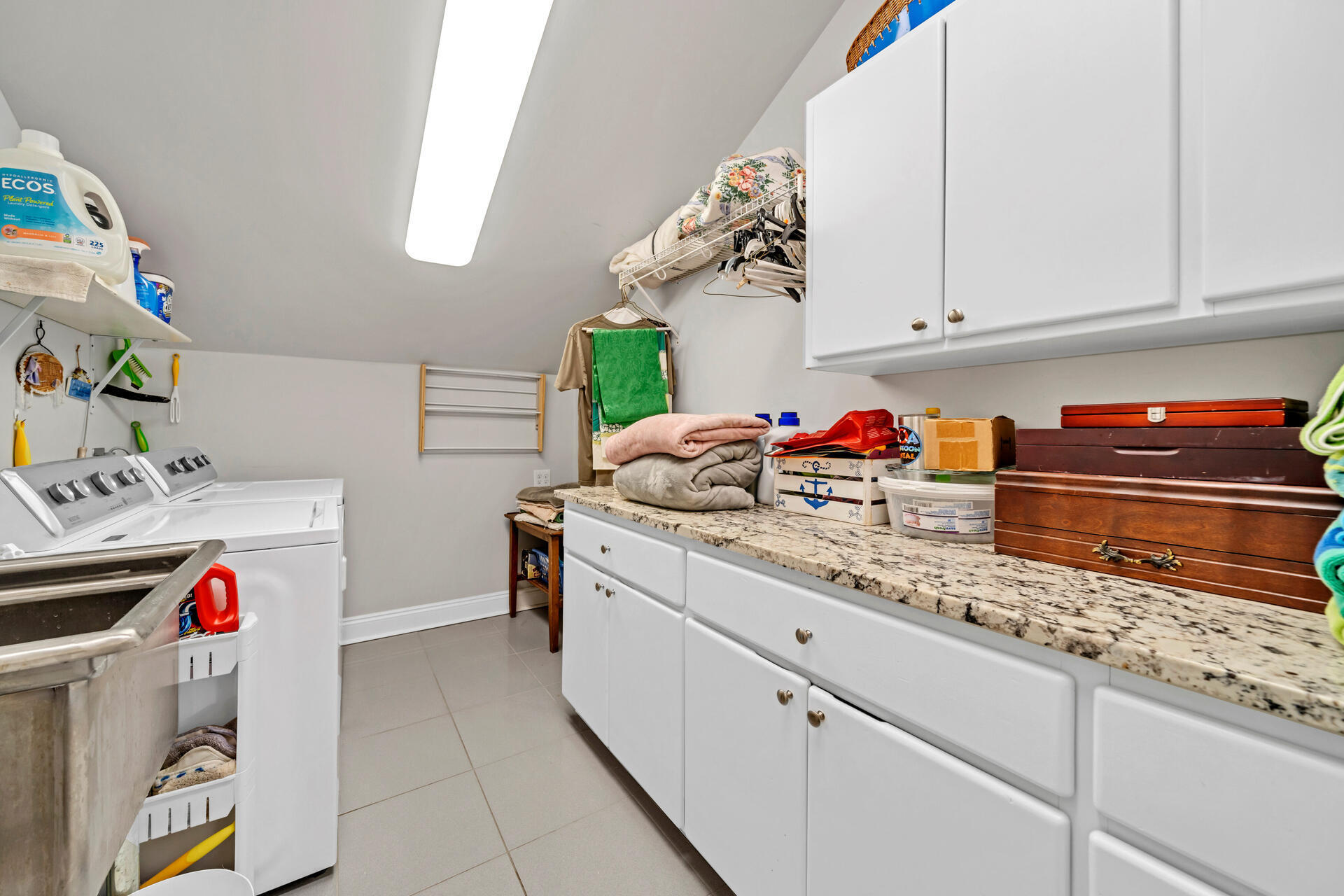 90 Delbert Lane Santa Rosa Beach, FL 32459 - Photo 13 of 47 a kitchen with white cabinets and sink