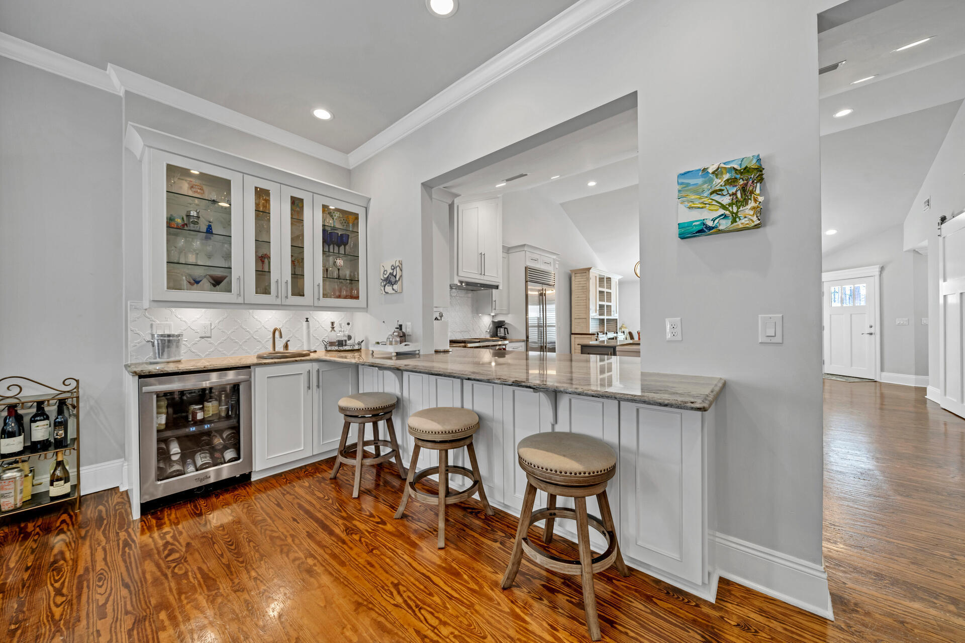90 Delbert Lane Santa Rosa Beach, FL 32459 - Photo 24 of 47 a living room with stainless steel appliances kitchen island granite countertop furniture and a wooden floor