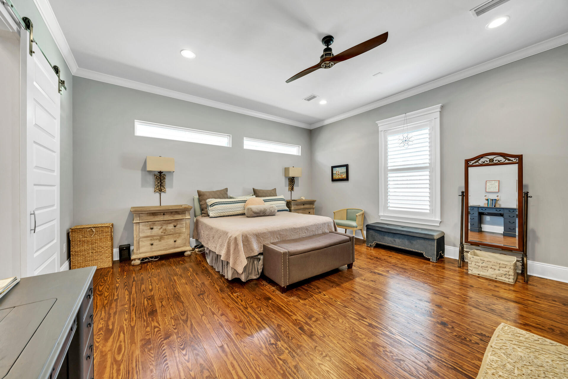 90 Delbert Lane Santa Rosa Beach, FL 32459 - Photo 29 of 47 a spacious bedroom with a bed and a flat tv screen on dresser