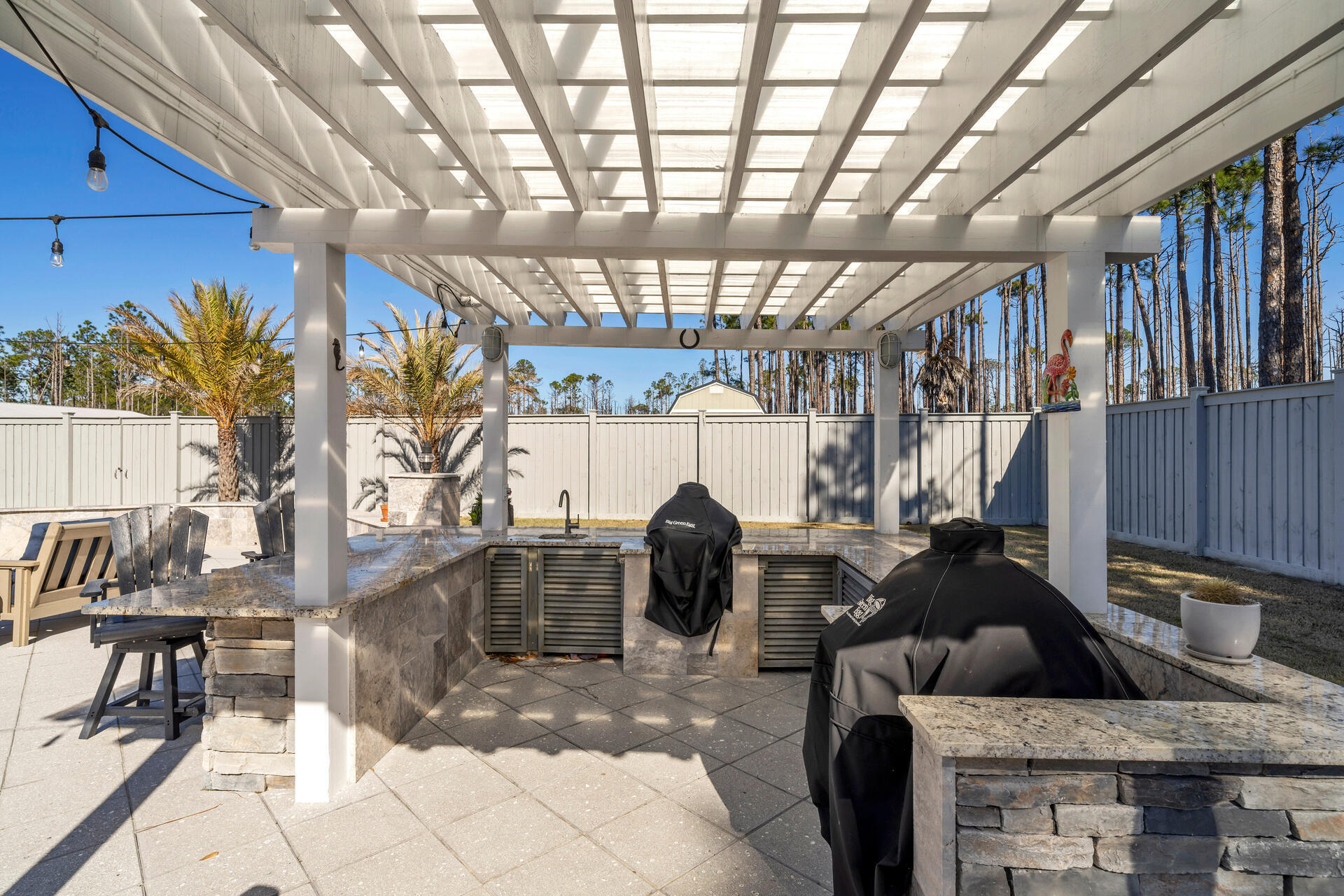 90 Delbert Lane Santa Rosa Beach, FL 32459 - Photo 39 of 47 a living room with furniture and a chandelier