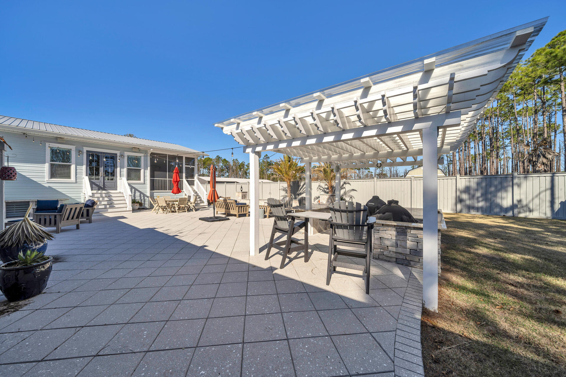 90 Delbert Lane Santa Rosa Beach, FL 32459 - Photo 40 of 47 a outdoor space with lots of table and chairs