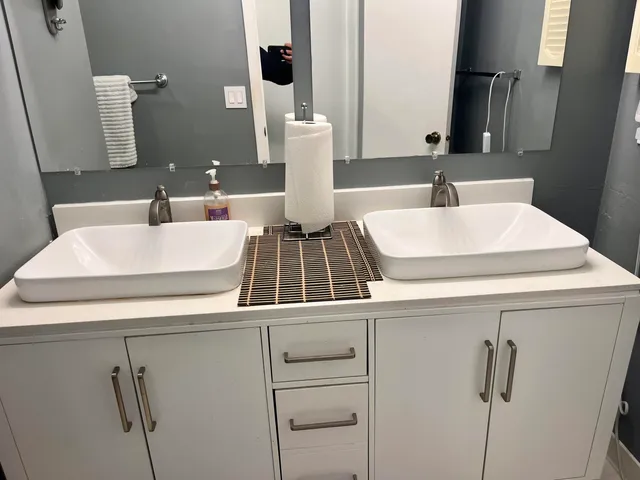 a bathroom with a sink and a mirror