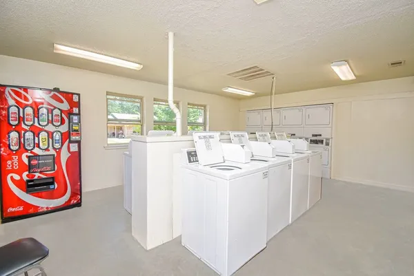 a kitchen with appliances and cabinets