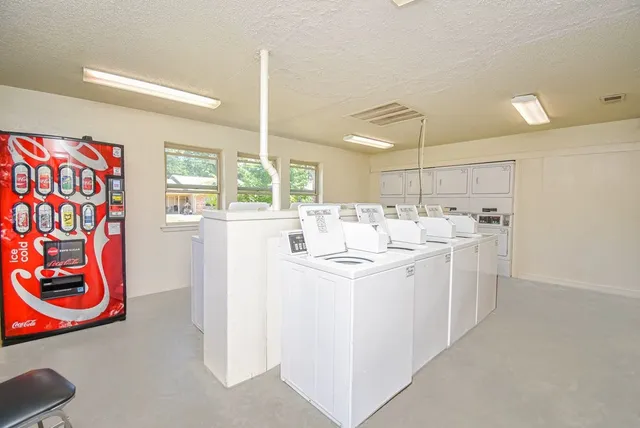 a kitchen with appliances and cabinets