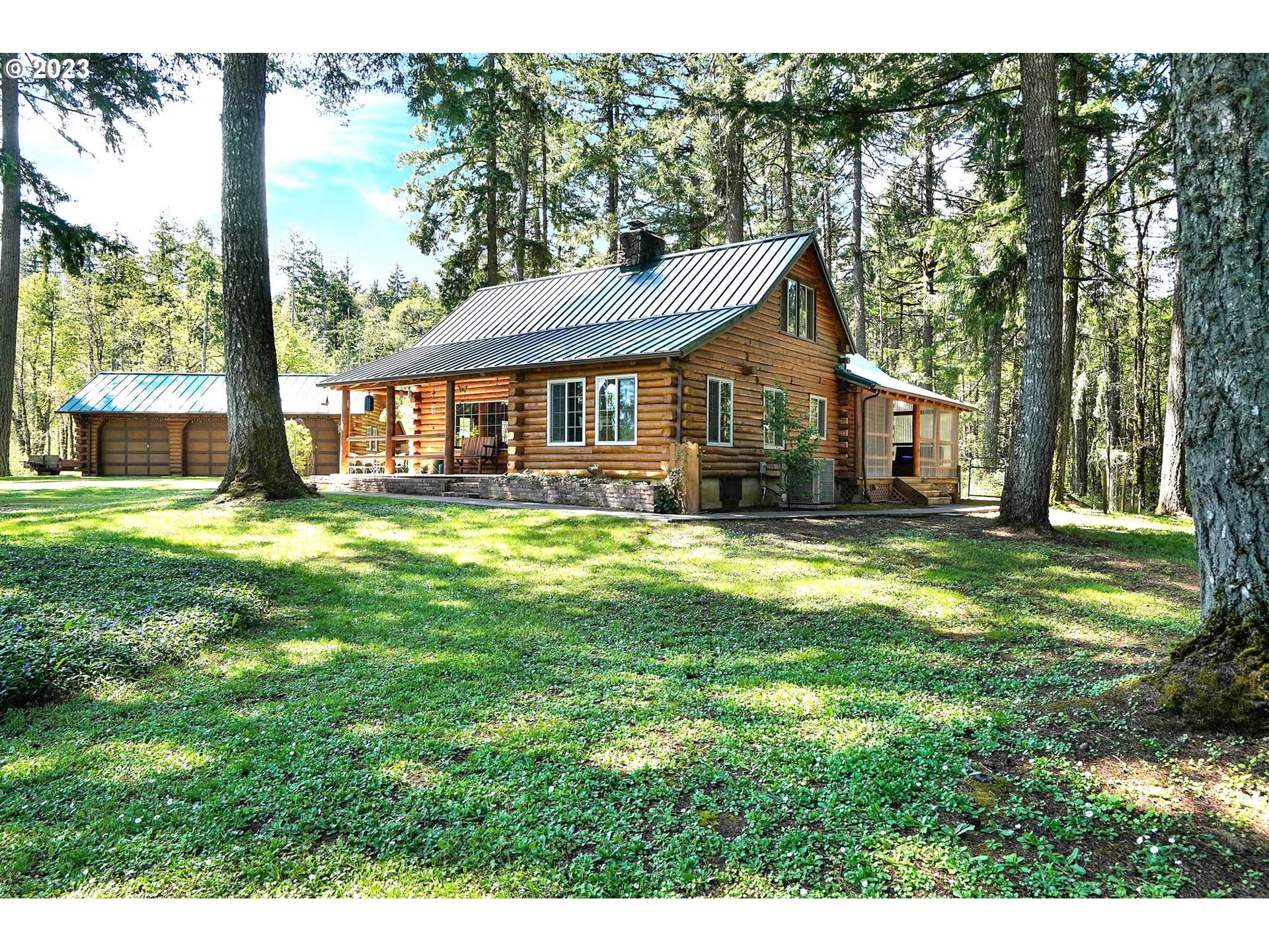 5625 Cooper Hollow Road Dallas, OR 97338 - Photo 1 of 48 a view of a house with a big yard potted plants and large tree