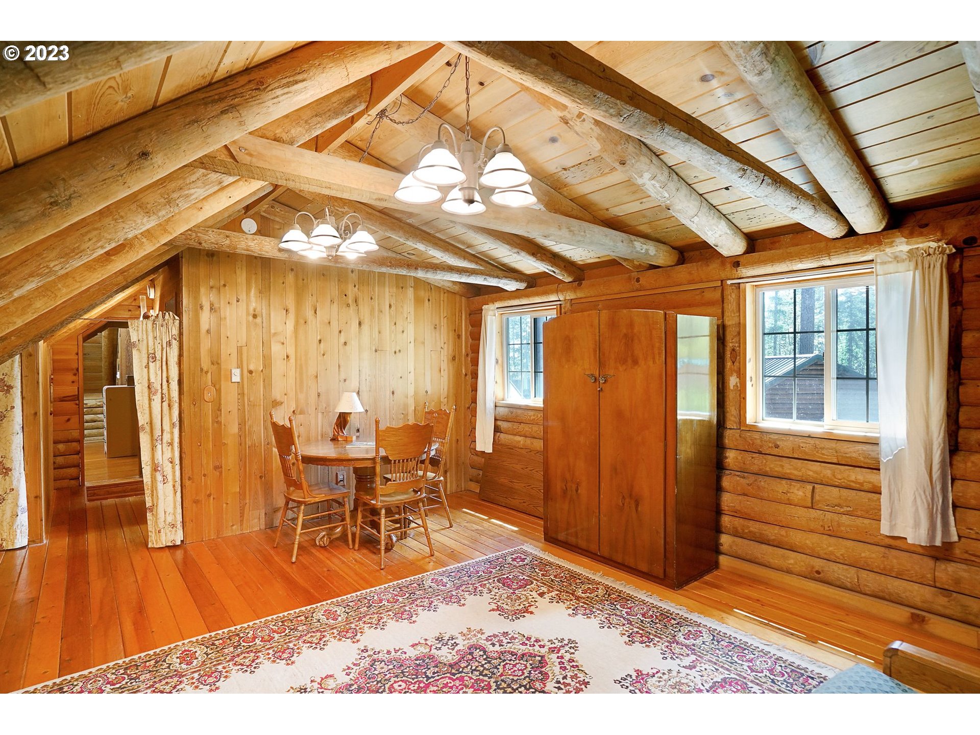 5625 Cooper Hollow Road Dallas, OR 97338 - Photo 21 of 48 a view of a living room with furniture and wooden floor