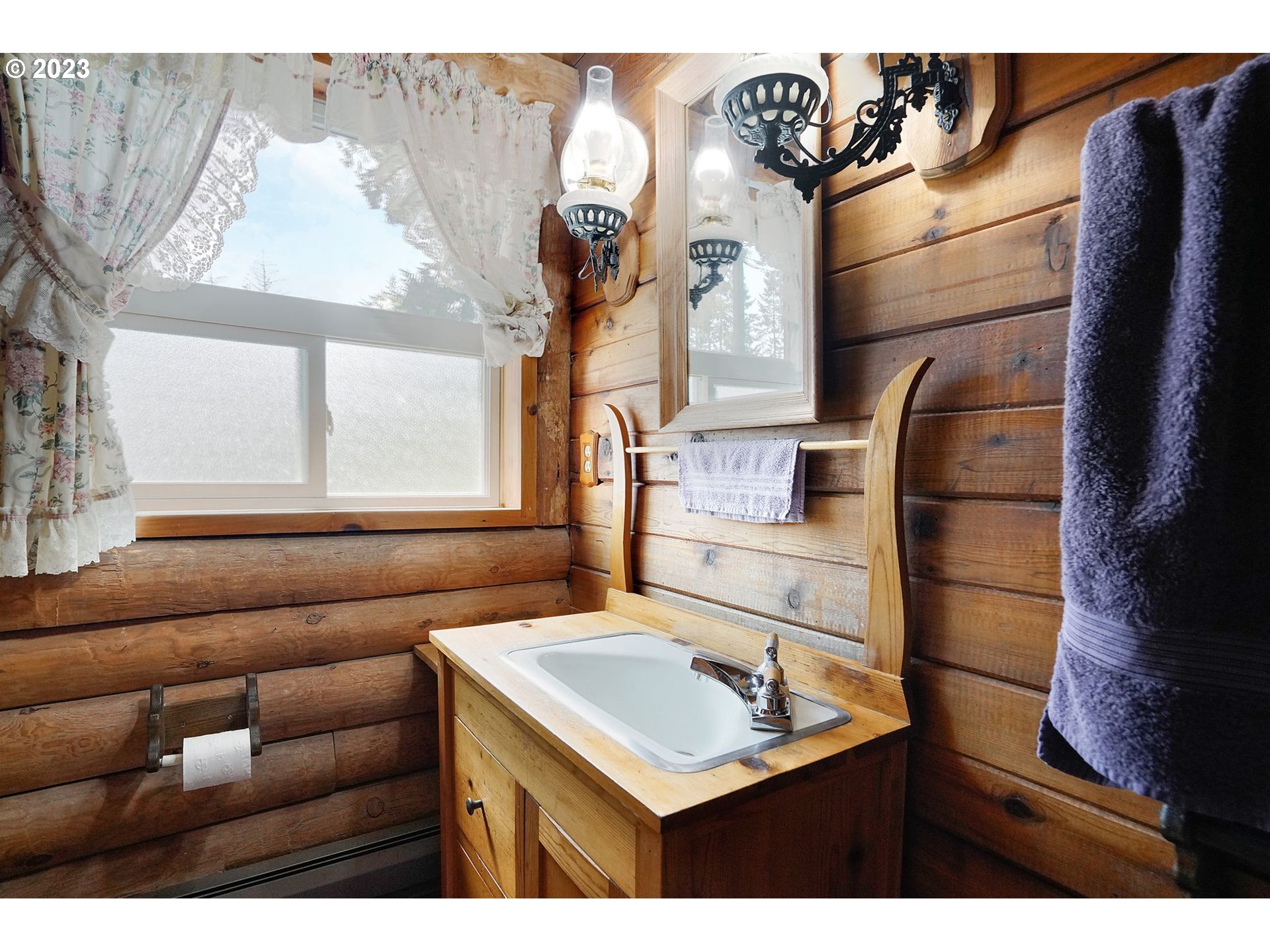 5625 Cooper Hollow Road Dallas, OR 97338 - Photo 23 of 48 a kitchen with a sink and a refrigerator