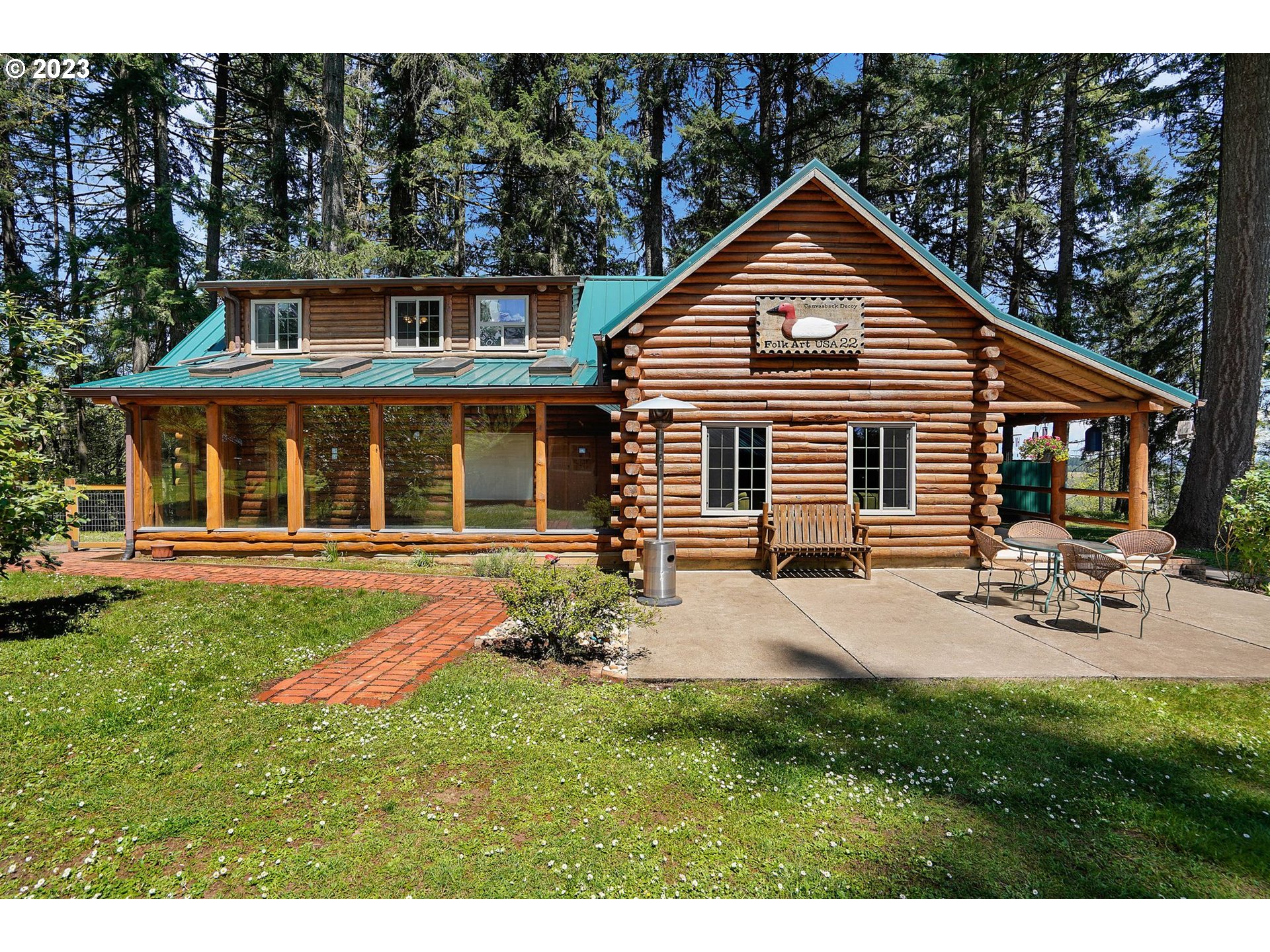 5625 Cooper Hollow Road Dallas, OR 97338 - Photo 32 of 48 a front view of a house with a yard and porch