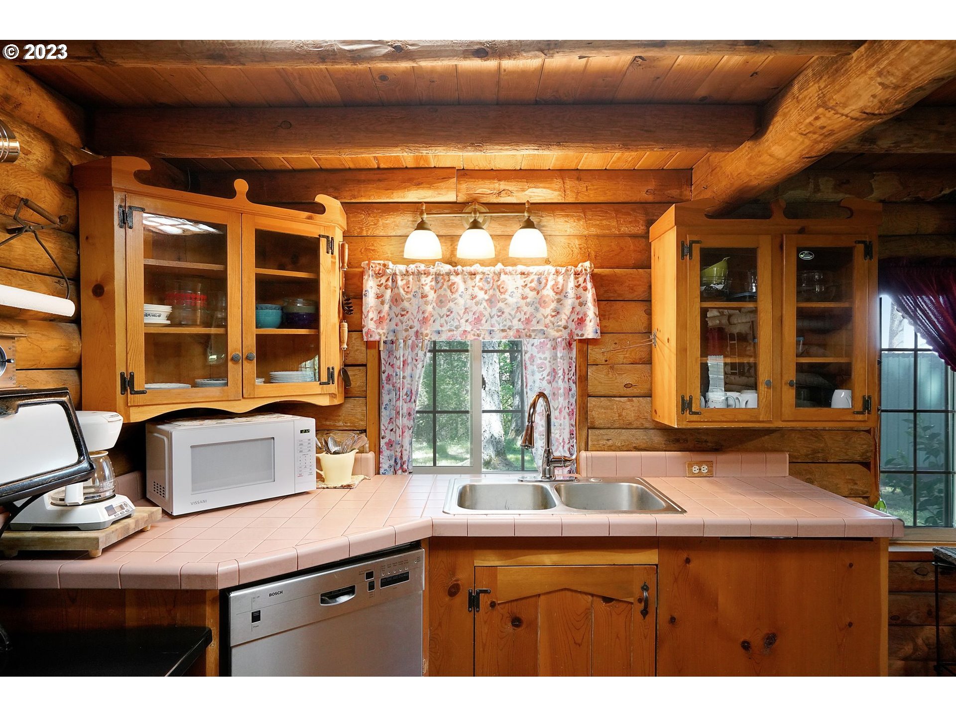 5625 Cooper Hollow Road Dallas, OR 97338 - Photo 9 of 48 a kitchen with a sink and large window