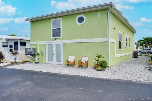 a front view of a house with a garage