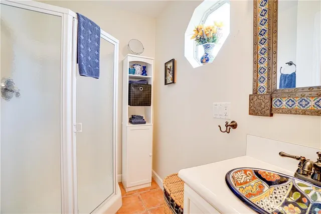 a bathroom with a tub and a view of bathroom