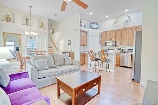 a living room with lots of furniture and wooden floors
