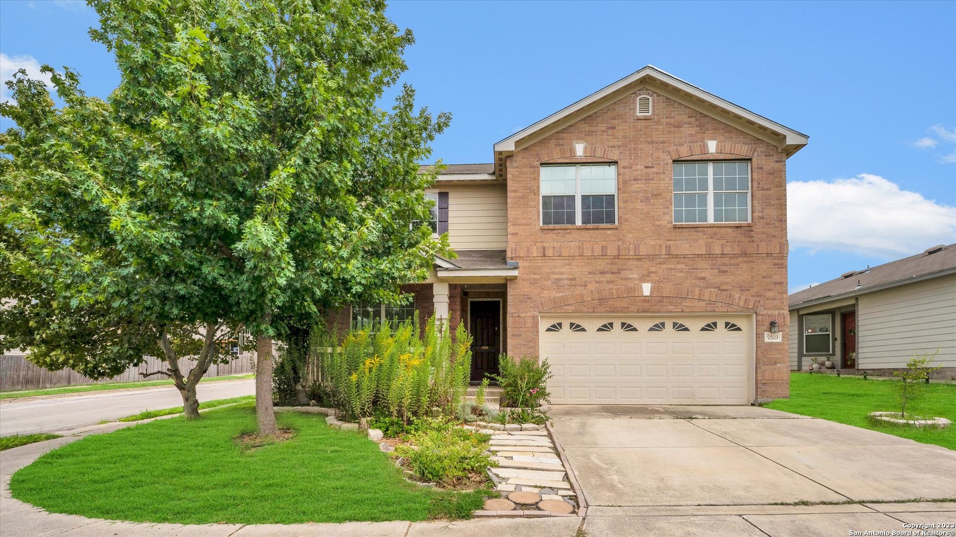 front view of a house with a yard