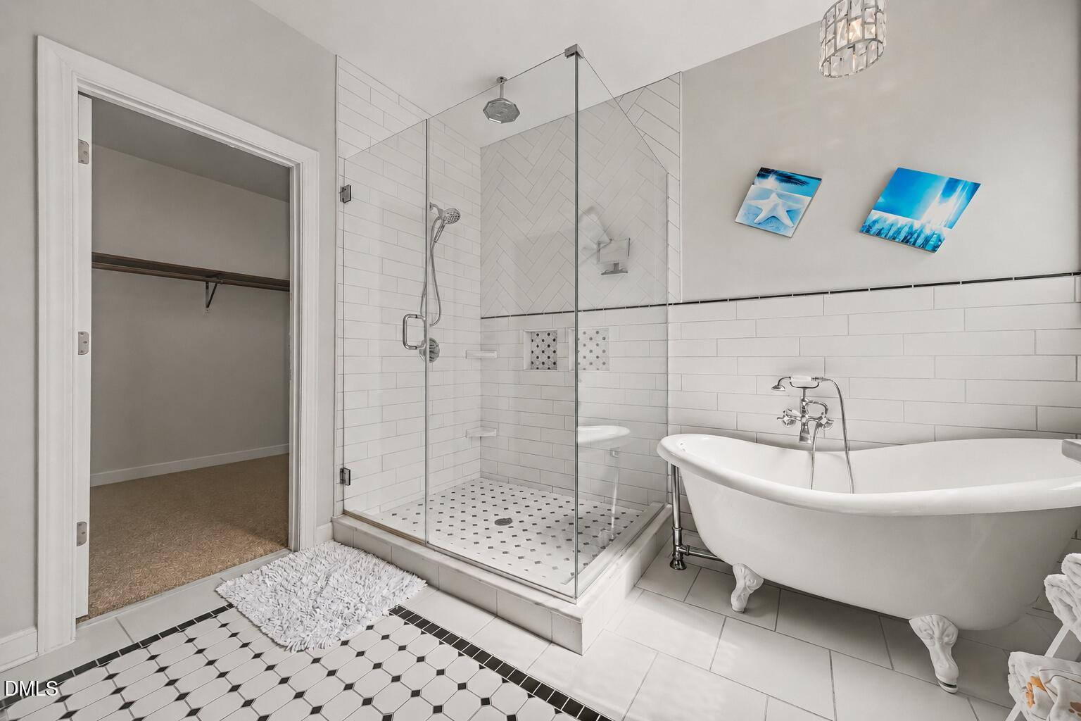 4000 Banks Stone Drive Raleigh, NC 27603 - Photo 25 of 60 a bathroom with a bathtub and a shower
