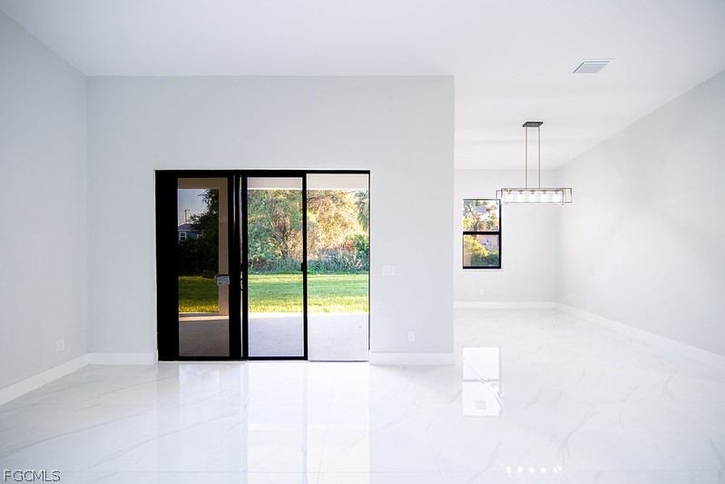 3313 36th Street Southwest Lehigh Acres, FL 33976 - Photo 11 of 27 a view of an empty room with window