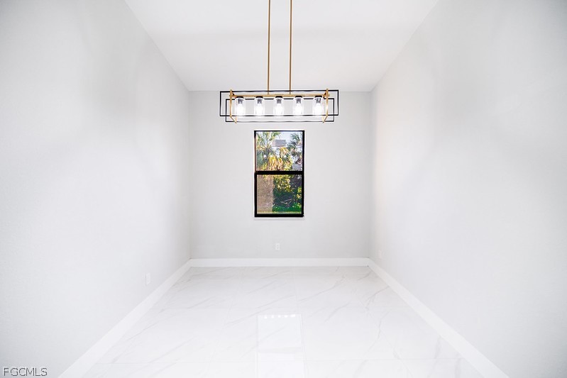 3313 36th Street Southwest Lehigh Acres, FL 33976 - Photo 12 of 27 a view of a window in a room