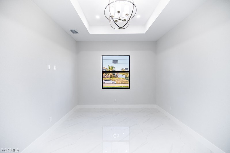 3313 36th Street Southwest Lehigh Acres, FL 33976 - Photo 13 of 27 an empty room with a window